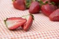 Red strawberry lying on the tablecloth Royalty Free Stock Photo